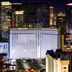 The Reserve at Park MGM in Las Vegas with illuminated Strip skyline and Park MGM facade at night