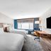 Holiday Inn Express La Mesa Near Sdsu By IHG guest room with two beds, desk, and large window