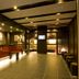 Dormy Inn Premium Kyoto Ekimae Natural Hot Spring lobby with warm lighting and check-in counter in Kyoto