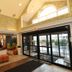 Quality Inn Harrisonburg lobby with seating and glass entrance doors