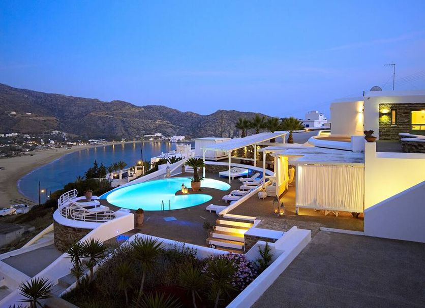 Levantes Ios Boutique Hotel in Mylopotas with a rooftop pool and bay view at dusk