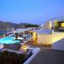 Levantes Ios Boutique Hotel in Mylopotas with a rooftop pool and bay view at dusk
