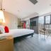 ibis Xi'an North Railway Station Hotel room with city view and floor-to-ceiling windows in Xi'an
