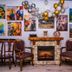 Casa Octavian in Suceviţa lounge with fireplace, gallery wall art and upholstered chairs