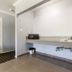 Hollywood Palms Inns & Suites Los Angeles kitchenette with sink, microwave, and countertop