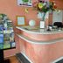 Hotel Val Vert in Pouilly-en-Auxois reception desk with flowers and brochure display
