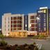 Home2 Suites by Hilton Florence hotel exterior at dusk with entrance and parking lot