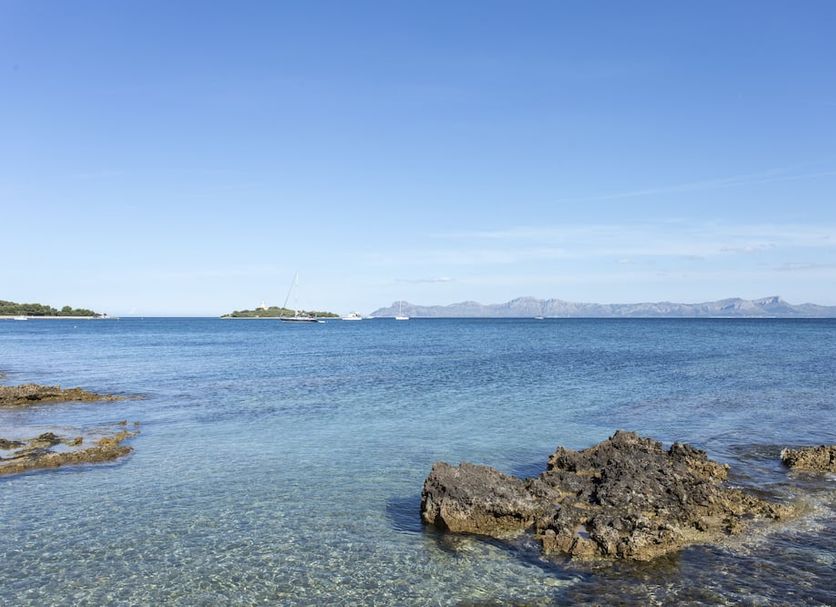 Mar Hotels Alcanada in Alcúdia with rocky shoreline and clear sea view