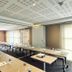 Fasthotel Toulouse Blagnac Aéroport meeting room with U-shaped tables, projector, and bright windows in Blagnac