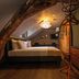 Buitenplaats Kasteel Elsloo room in Stein with exposed beam, bed, and sloped attic ceiling
