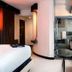 Hard Rock Hotel & Casino Biloxi room with bed, glass bathroom, and city view in Biloxi