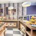 Breakfast buffet at Leonardo Hotel Wolfsburg City Center in Wolfsburg with pastries, fruit and hot dishes