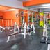 Hotel Chanma International in Coimbatore gym with weight machines and mirrored walls