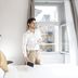 Three Corners Hotel Art Budapest room with man by window and geometric wall art