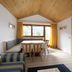 Christophorus Mountain Residence in San Vigilio di Marebbe, bright dining nook with mountain view and sofa