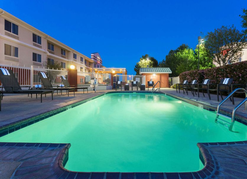 Fairfield Inn & Suites by Marriott Odessa outdoor pool illuminated at dusk