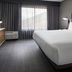 Courtyard by Marriott San Mateo Foster City guest room with king bed, desk, and window view