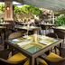 The Westin Princeville Ocean Resort Villas outdoor restaurant seating in Princeville with rock garden backdrop