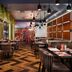 Cairn Hotel Newcastle Jesmond restaurant interior in Newcastle upon Tyne with patterned wood floor and booths
