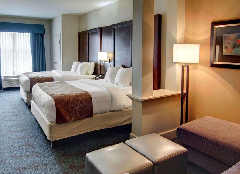 Comfort Suites Texarkana guest room with two queen beds and sitting area