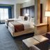 Comfort Suites Texarkana guest room with two queen beds and sitting area