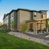 My Place Hotel-Colorado Springs, co exterior with covered entrance, parking lot, and mountain view