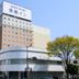 Toyoko Inn Iwaki Ekimae in Iwaki, exterior of tall hotel building on a city street