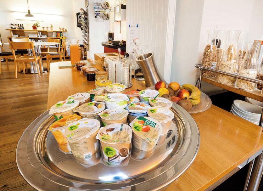 Hotel Roter Ochsen Solothurn breakfast buffet with yogurt cups, fruit and dining area