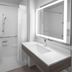 Holiday Inn Express & Suites Montrose - Black Canyon Area by IHG bathroom with roll-in shower and lit vanity