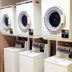 Toyoko Inn Himeji eki Shinkansen Minami guchi laundry room with stacked washers and dryers in Himeji