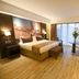 Mestil Hotel & Residences in Kampala room with king bed, work desk and balcony view