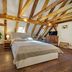Hotel Svambersky dum room in Český Krumlov with exposed beams and a double bed