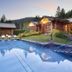 The New Ronacher Thermal Spa Hotel in Bad Kleinkirchheim with outdoor thermal pool and mountain-view log cabins