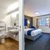 Days Inn by Wyndham London Stansted Airport bathroom and guest room in Bishop's Stortford
