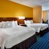 Fairfield Inn by Marriott Myrtle Beach Broadway at the Beach guest room with two beds and ocean-blue carpet