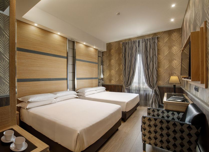 Hotel Morgana Rome twin room with two beds, window curtains and desk
