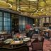 Four Seasons Hotel Shenzhen dining room with circular ceiling lights and set tables in Shenzhen