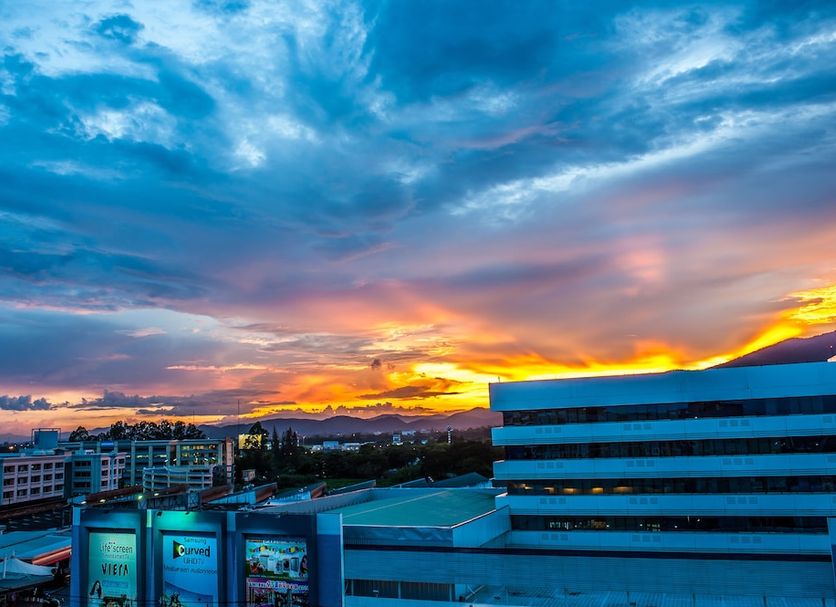 Airport Resident 2 in Chiang Mai with city skyline and dramatic sunset sky