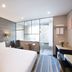 Benikea Hotel Haeundae in Busan guest room with queen bed, desk, chair, and large window