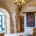 Artist Quarter Guesthouse B&B in Zefat: stone-arched room with hanging lantern and open doorways