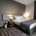 Hotel Blanca Resort & Spa in Šišava, guest room with king bed, bedside lamps, and floor-to-ceiling window