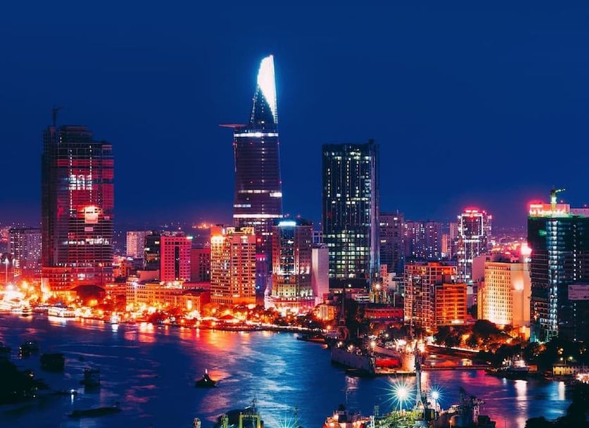 Vilion Central Hotel in Ho Chi Minh City with skyline and riverfront city lights at night
