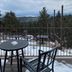 Pikes Peak Paradise Bed and Breakfast in Woodland Park with mountain view from snowy balcony