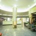 Dream 8 Business Hotel lobby in Taizhou with seating, front desk, and glossy floors