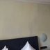 Etna Hotel & Ristorante room in Veitshöchheim with bed, wall mirror and open wooden door