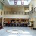 Orange Crystal Hotel Xuzhou Suning Plaza lobby with front desk, mezzanine balcony and skylight in Xuzhou