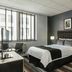 Broadway Plaza Hotel, New York: guest room with queen bed, desk, black chair and window city view