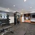 Fairfield by Marriott Inn & Suites Kansas City Airport fitness center with weights and exercise machines