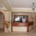 Rosy Suites Hotel, Kusadasi lobby reception desk with arched doorways and hanging lantern