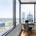 Mint House Dallas Downtown By Kasa room with desk by windows and city skyline views in Dallas